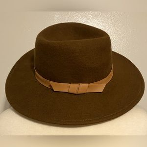 Dark camel colored 100% wool hat with faux leather band. Cute fall accessory!